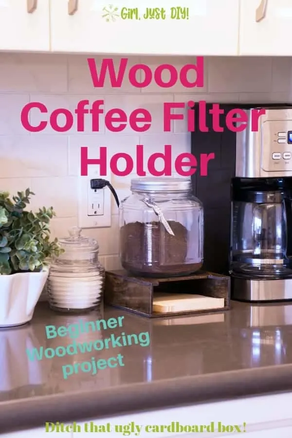 Glass jar on top of wood coffee filter holder next to coffee pot.