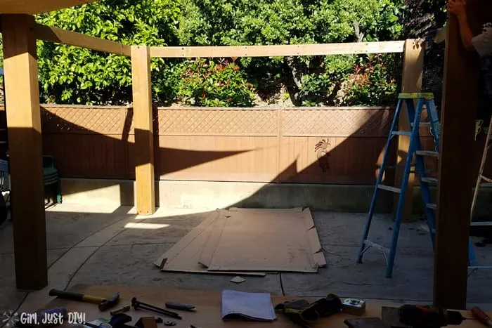 Partial diy patio gazebo frame assembled, 3 posts and fascia.