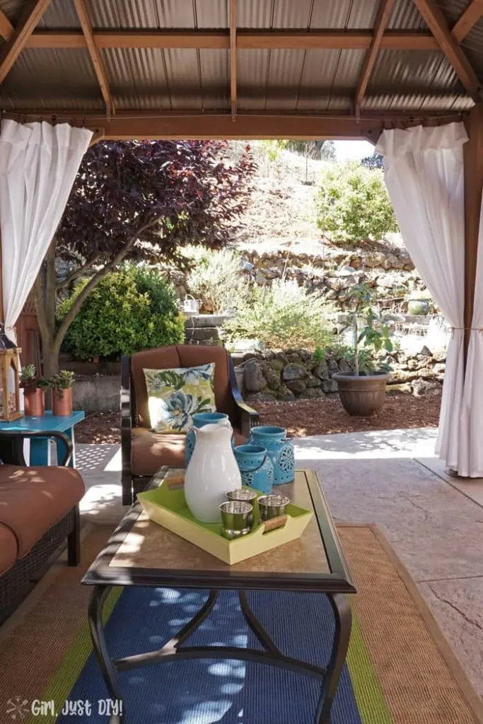 Side yard view from diy patio gazebo in daylight.