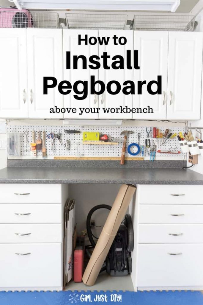 Pegboard hung above garage workbench with tools.