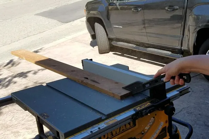 Ripping wood on a table saw.