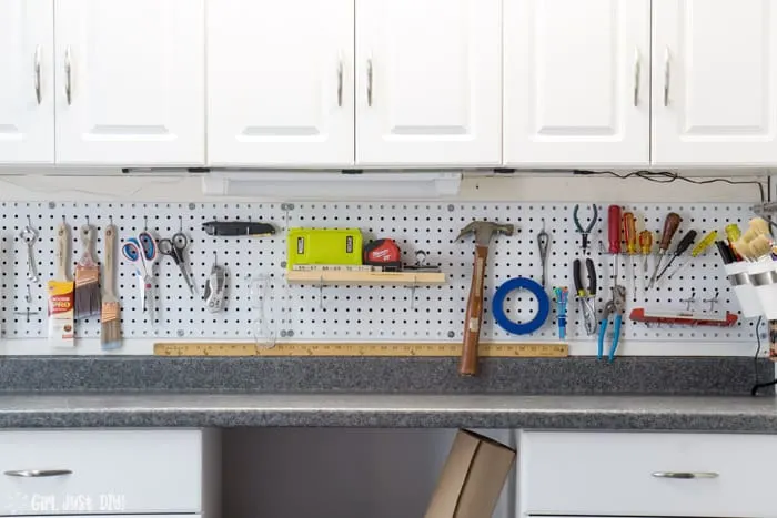 Wide shot of installed pegboard filled with tools.