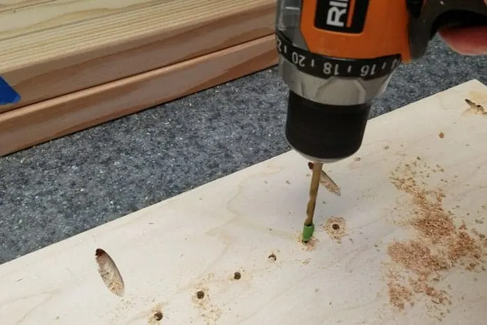 Drilling holes for shelf pins.