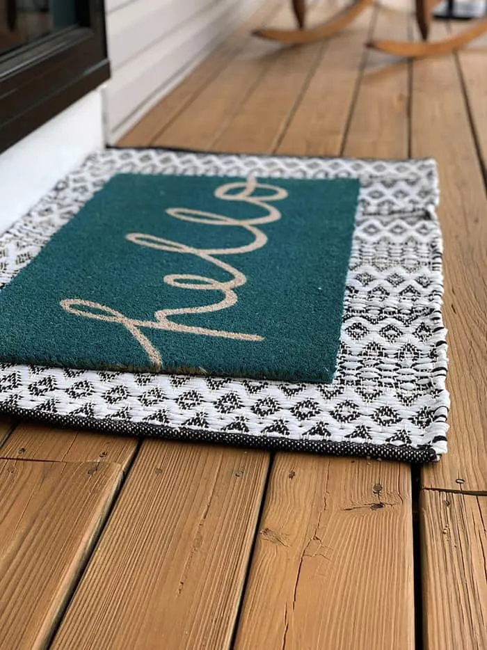 Welcome mat on porch for Outdoor diy projects to update your curb appeal.