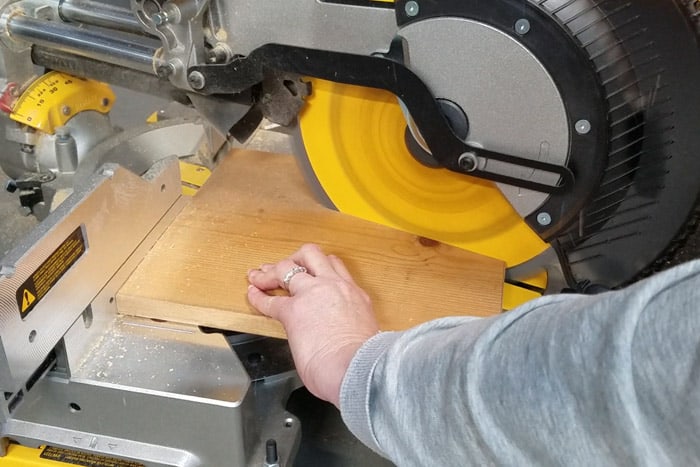 Cutting board to correct 15 degree angle and size with miter saw.