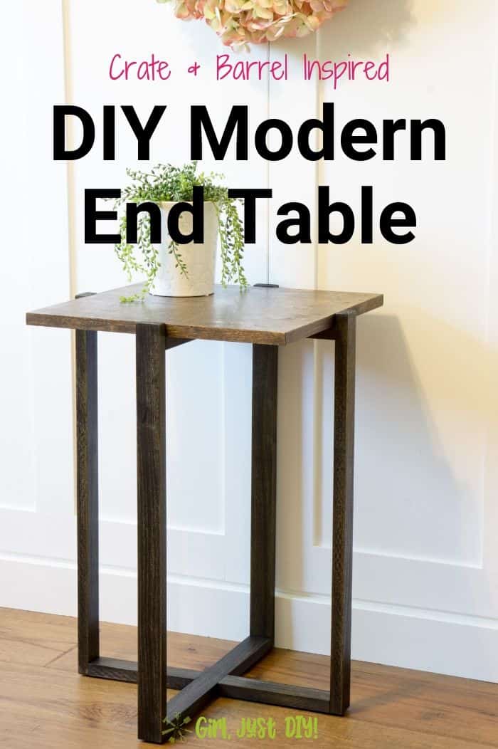 Walnut and Ebony DIY End Table by wall with a houseplant on top below a wreath.