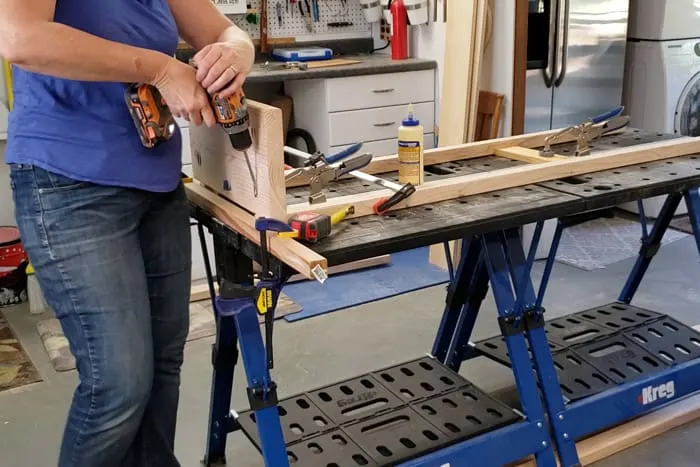 Attaching bottom shelf to legs for 2x4 plant stand.
