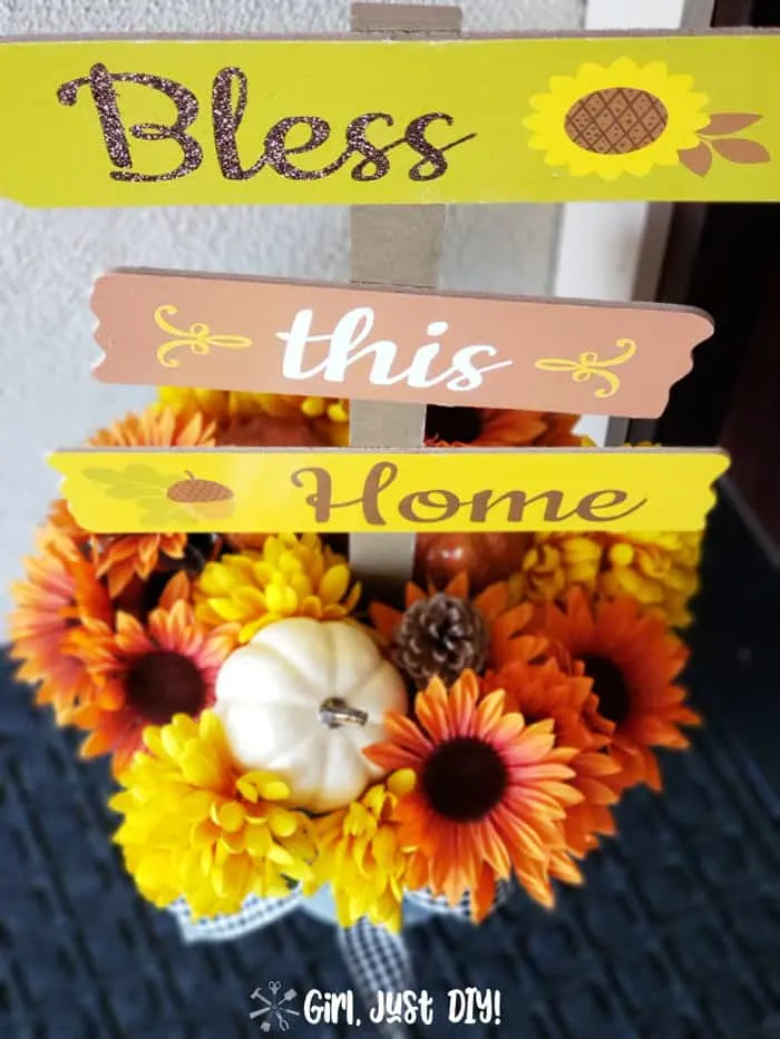 Budget-friendly dollar store fall decor with fall wreaths, autumn decorations, and stacked pumpkins for porch.