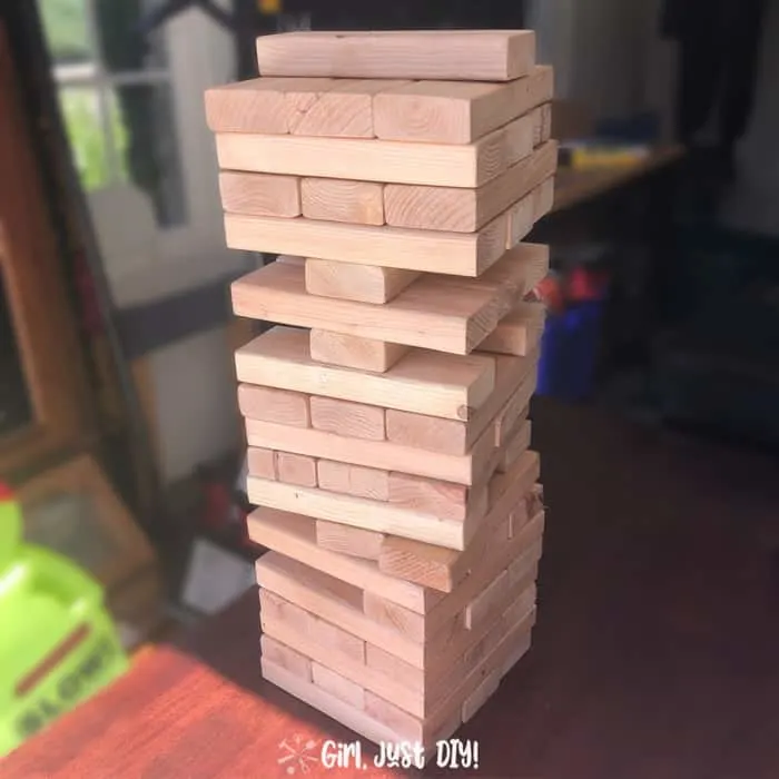 DIY Giant Jenga Game on table and play underway.