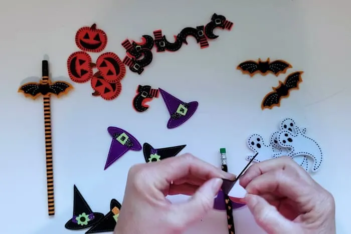 Peeling the back off of a felt halloween sticker.