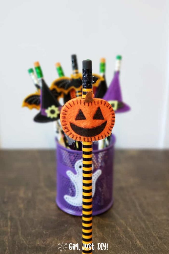 Pumpkin sticker on orange and black pencil is are cute non-candy halloween treats for kids.