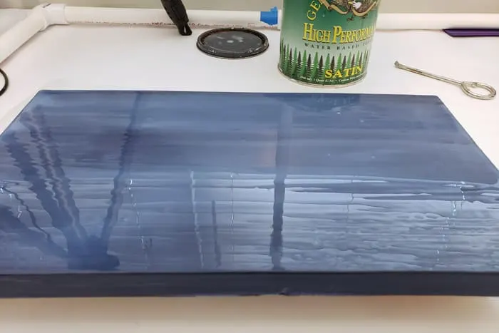 Fully covered blue board with wet clear coat