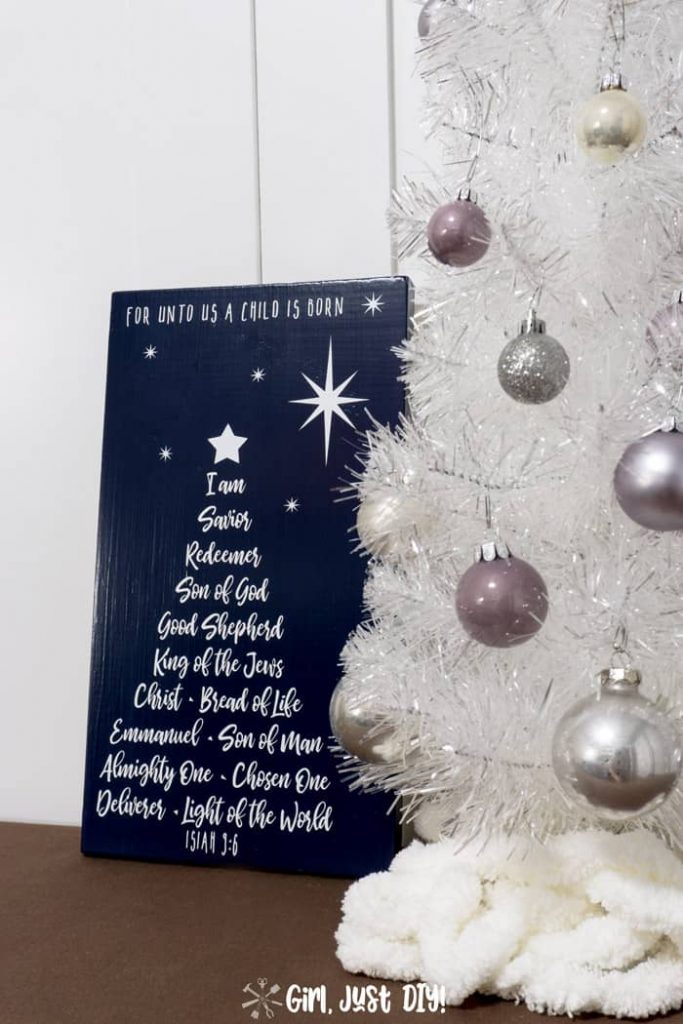 Side angle shot of Christmas Tree Word Art next to white Christmas tree