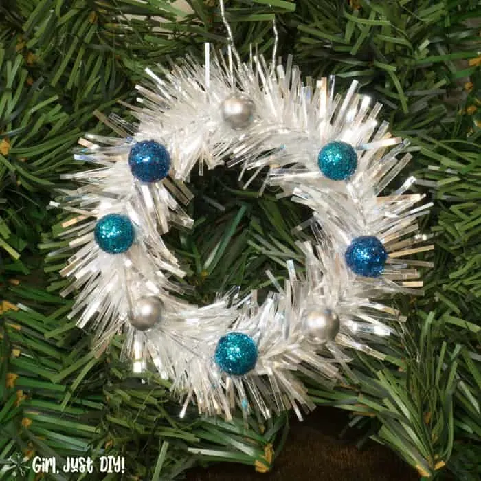Single mini wreath ornament with blue berries closeup