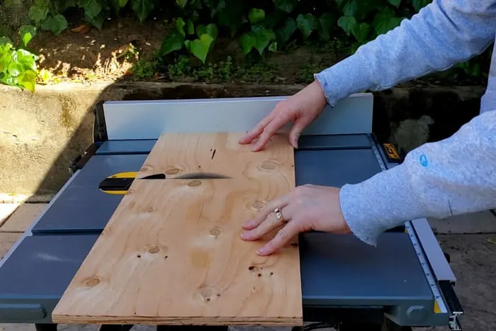 Cutting short sections of plywood on a table saw
