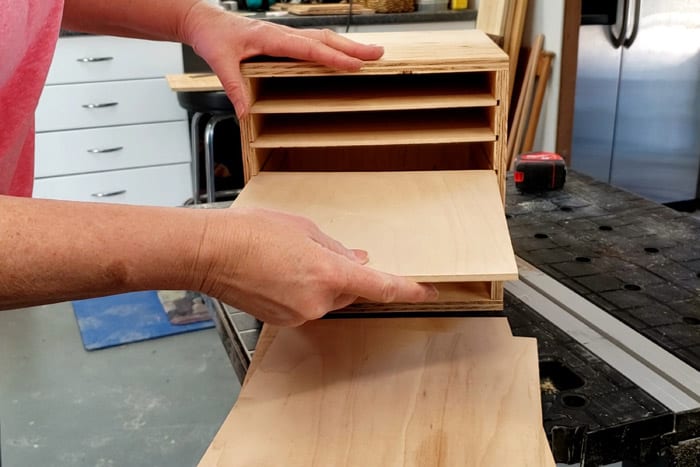 Inserting sandpaper shelves into the diy sandpaper storage rack cabinet