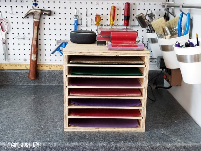 sandpaper rack on workbench filled with sandpaper