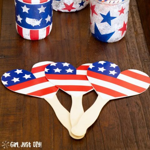 3 paper plate fans laying on the table