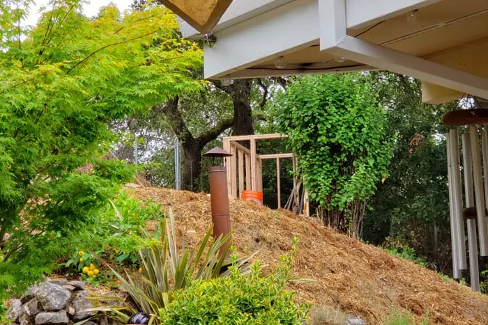 Framed shed visible from patio below