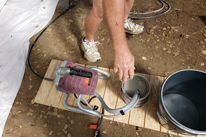 Airless paints sprayer to paint the shed.