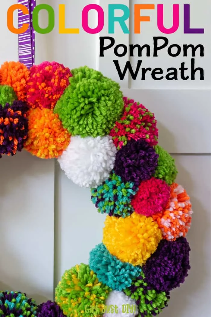 Colorful DIY Pompom Wreath closeup with text in upper right corner.