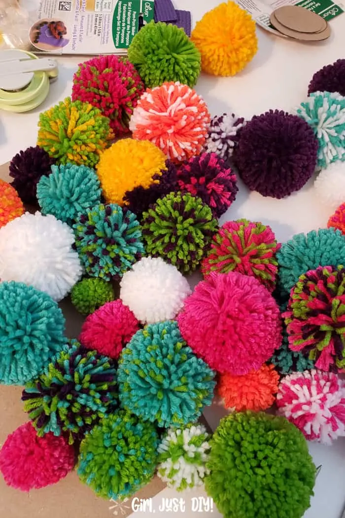 pile of colorful pompoms ready to make a wreath