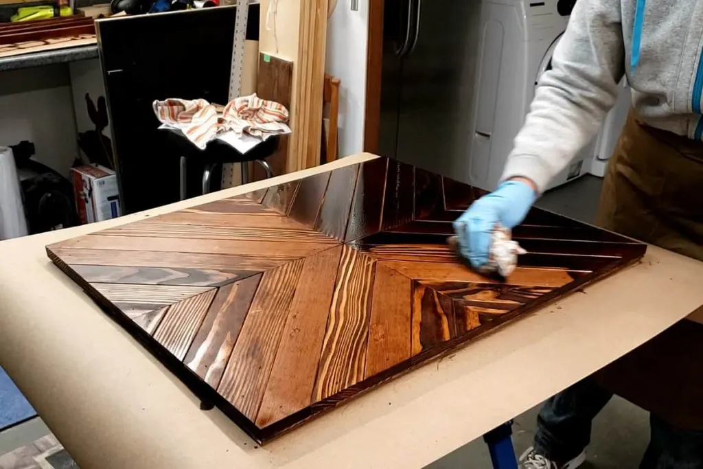 Staining raw wood using an old rag