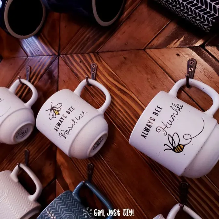 Closeup of coffee cups on mug rack
