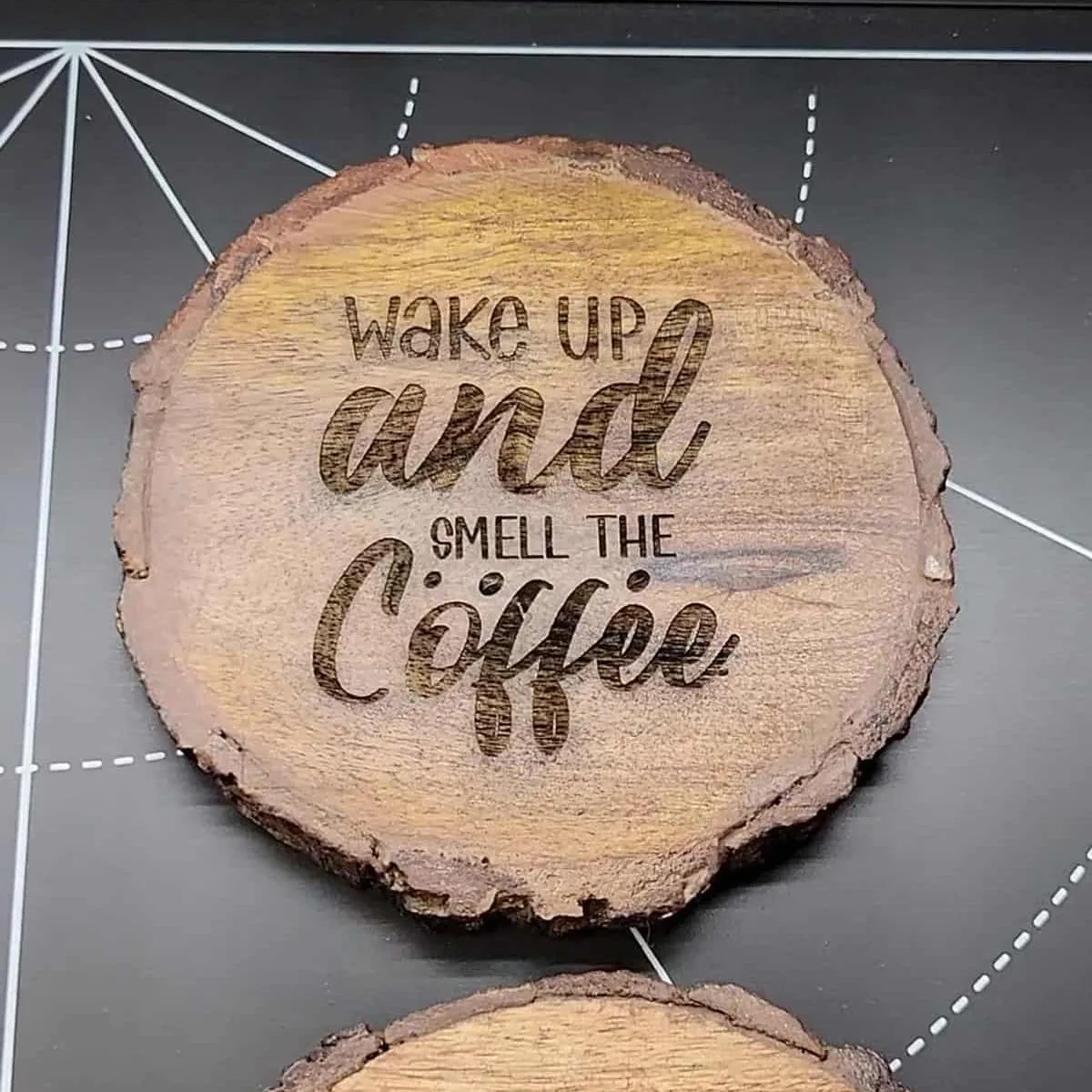 laser engraved wood coaster that says "wake up and smell the coffee.