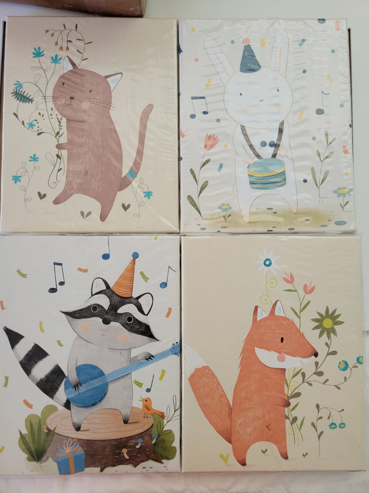 Set of four Children's artwork canvases in plastic.