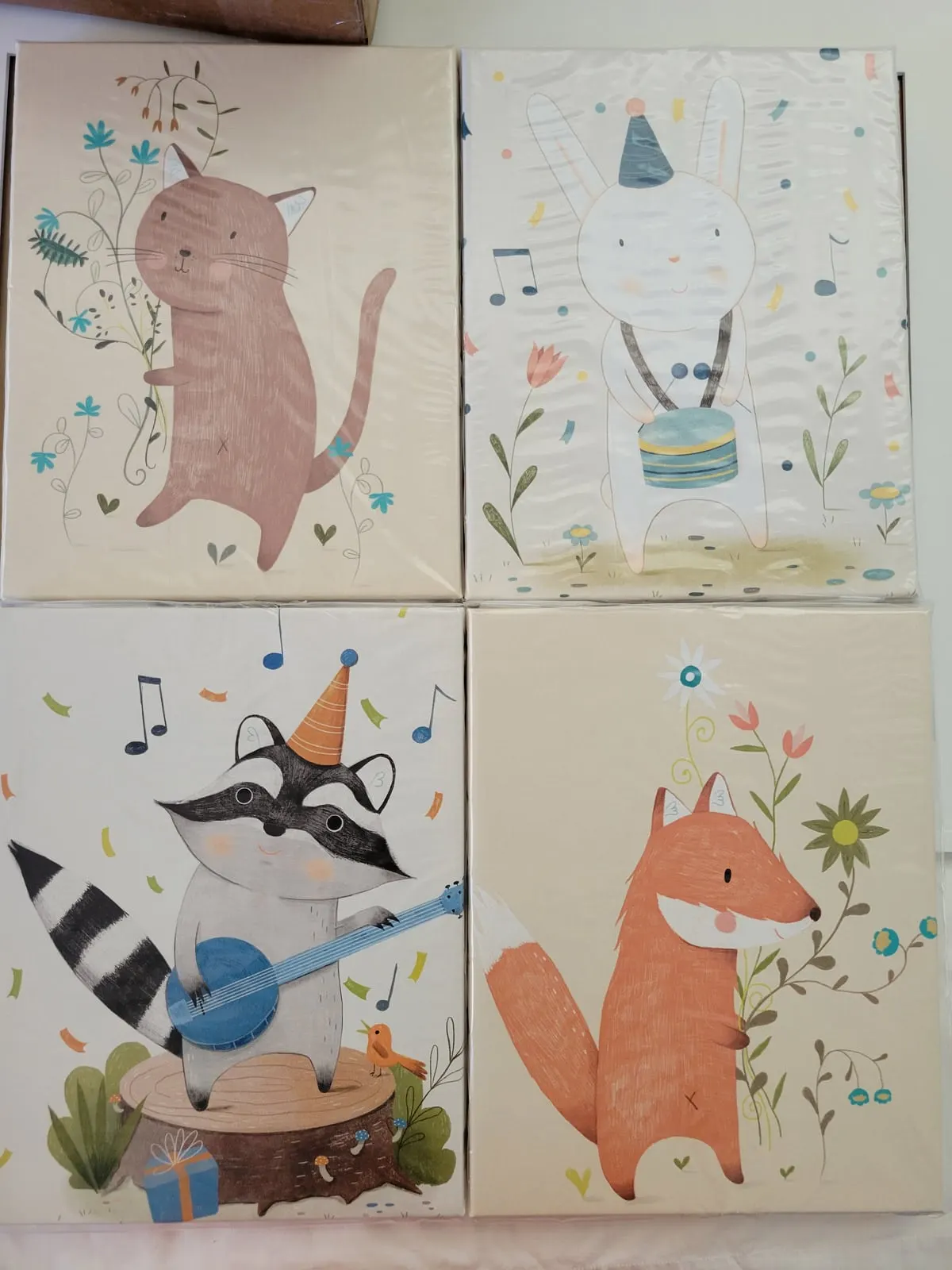 Set of four Children's artwork canvases in plastic.