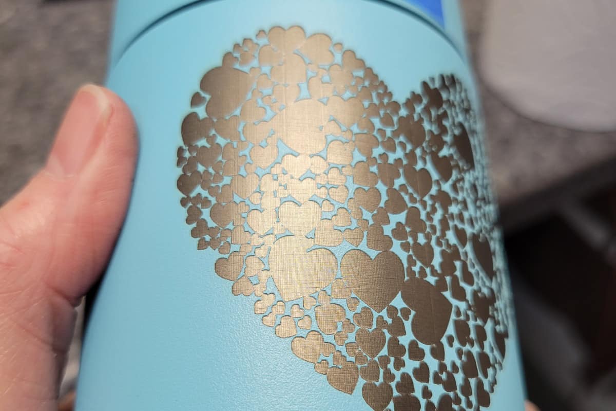 Closeup of the engraving on the blue tumbler