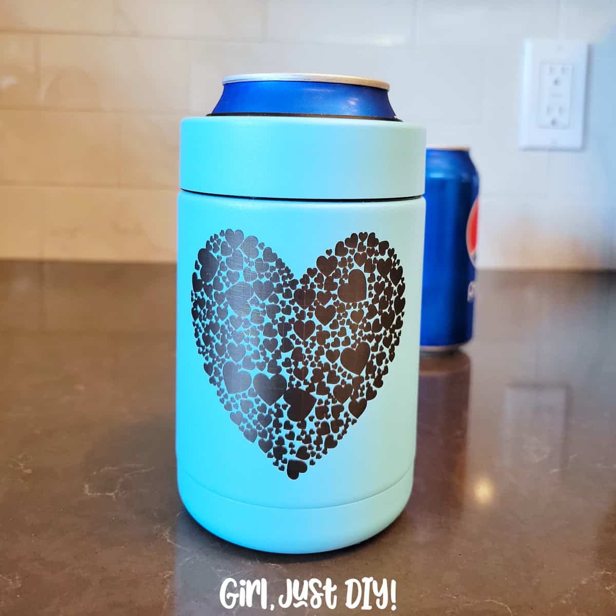 Heart on a laser engraved tumbler with soda can.