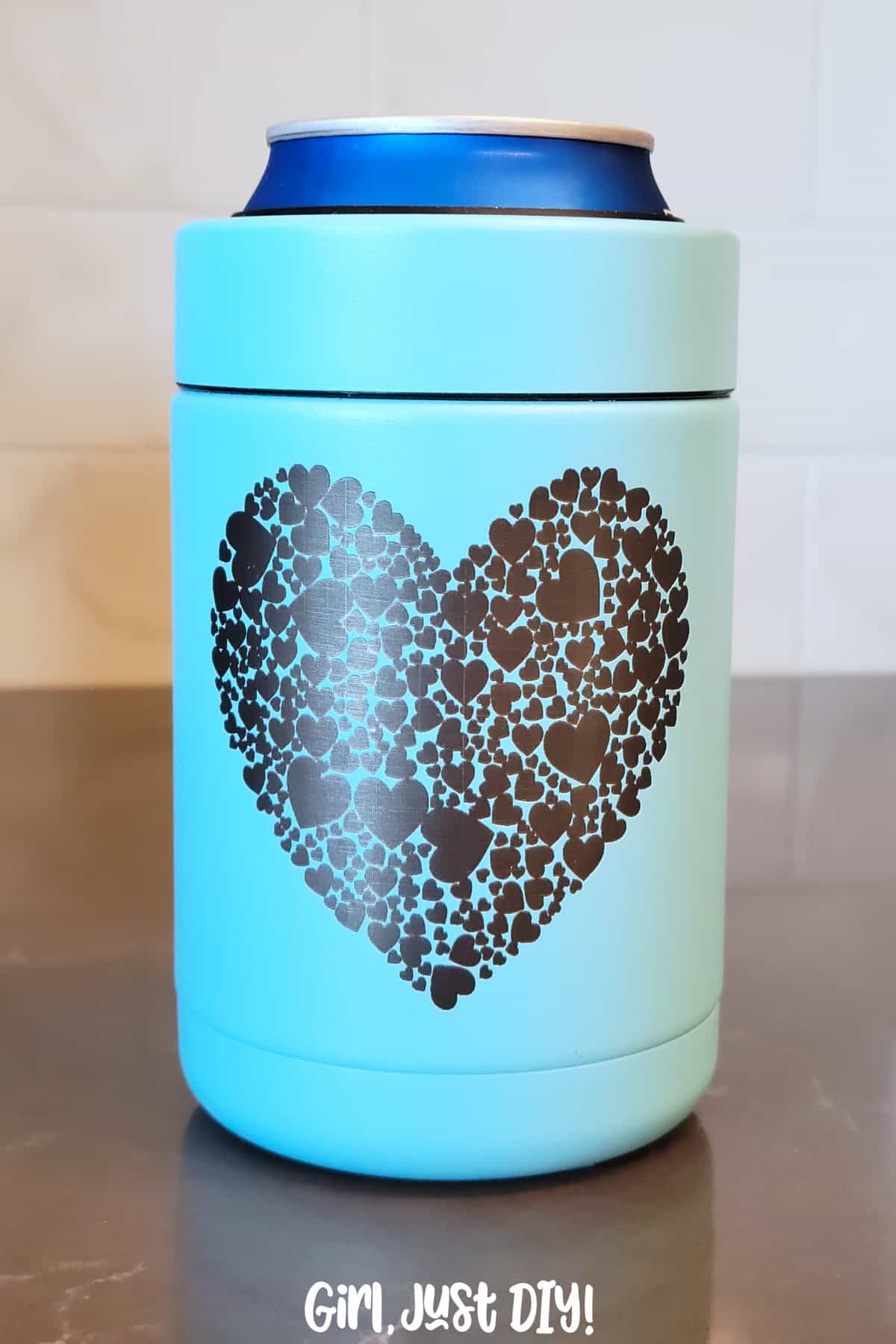 Engraved blue tumbler with hearts on front.