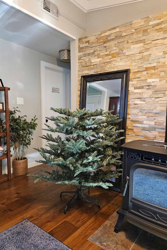 Assembly of 2/3 of an artificial christmas tree.